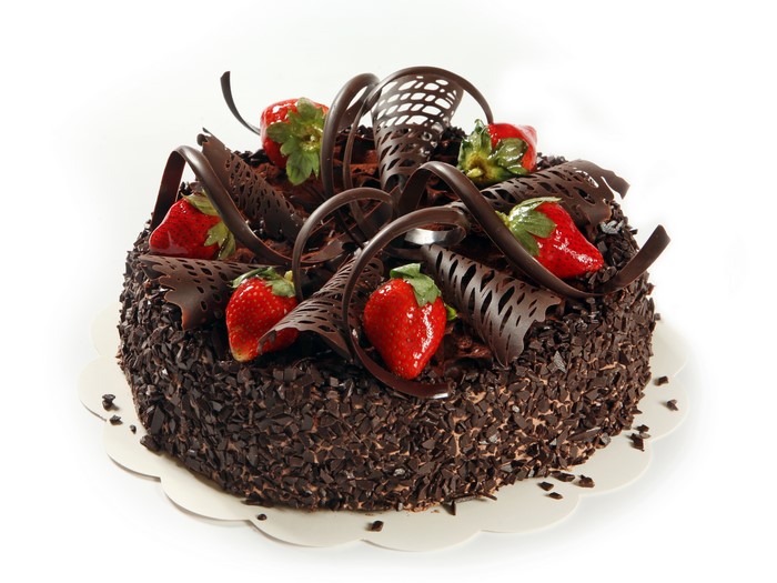 Chocolate cake with strawberries and chocolate curls