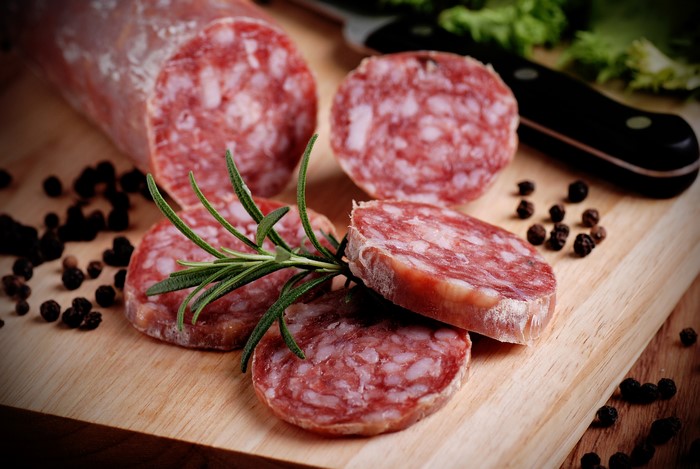Sausage slices with rosemary and peppercorns