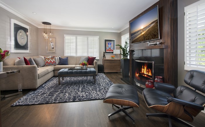 Living room with sectional sofa, fireplace, and armchair