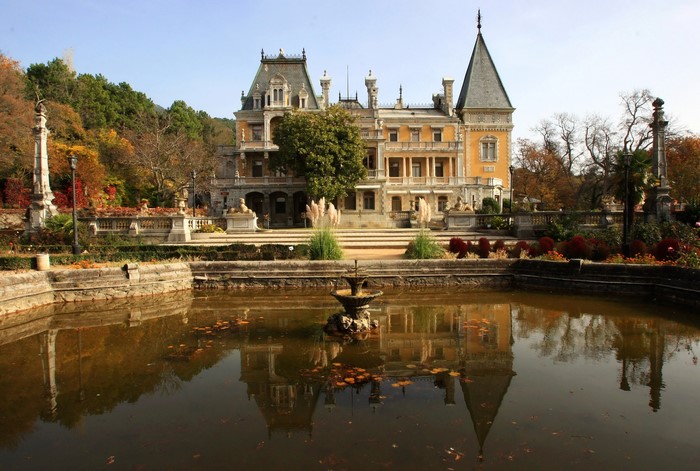 Palace with a fountain and reflection in Russia