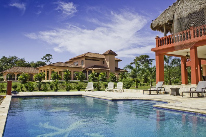 Luxury Mansion with Swimming Pool and Lounge Chairs