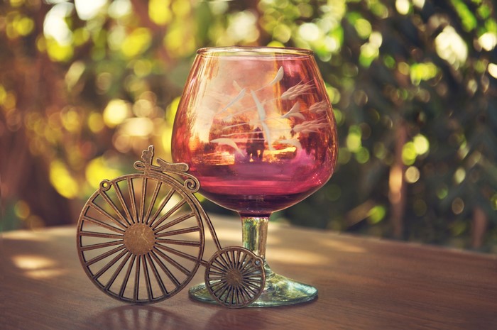 Glass with a miniature bicycle