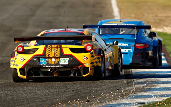 Ferrari 458 GTC and Porsche 911 race cars