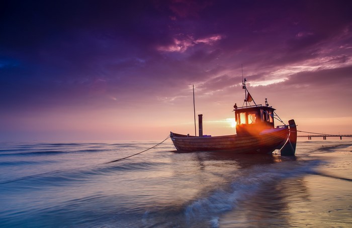Fishing boat on the Baltic Sea at sunset