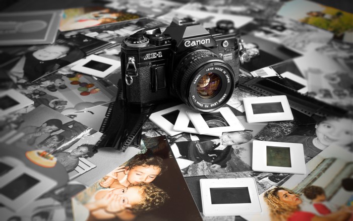 Canon AE-1 camera with photographs and slides