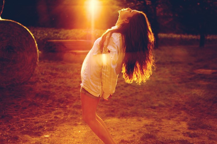 Woman with long hair in sunlight
