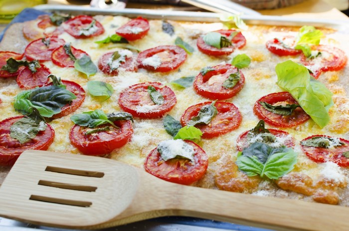 Tomato and Basil Pizza on a Baking Sheet