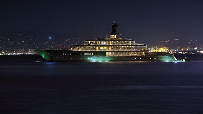 Luxury yacht illuminated at night on the sea