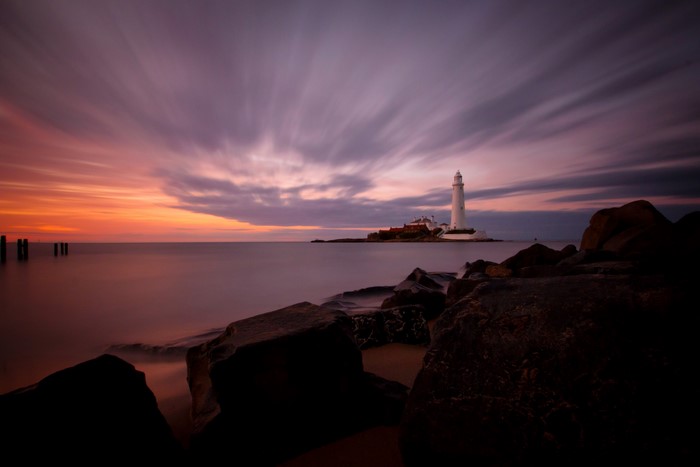 St. Marys Lighthouse at sunset over the sea