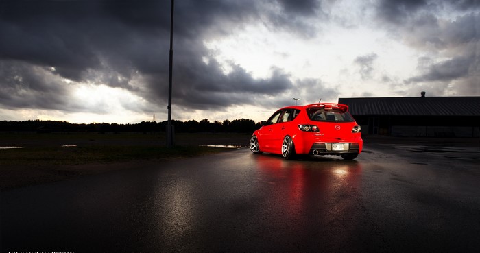 Red Mazda 3 Hatchback from behind