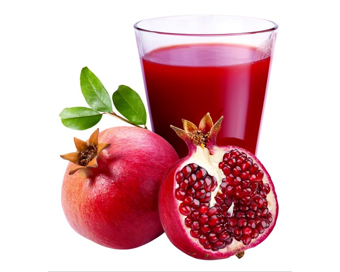 Pomegranate Juice in a Glass with Pomegranates