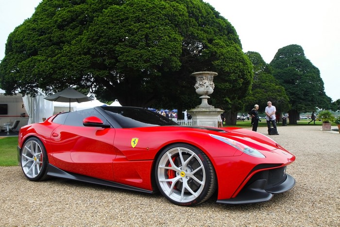 Red Ferrari F12 TRS parked outdoors