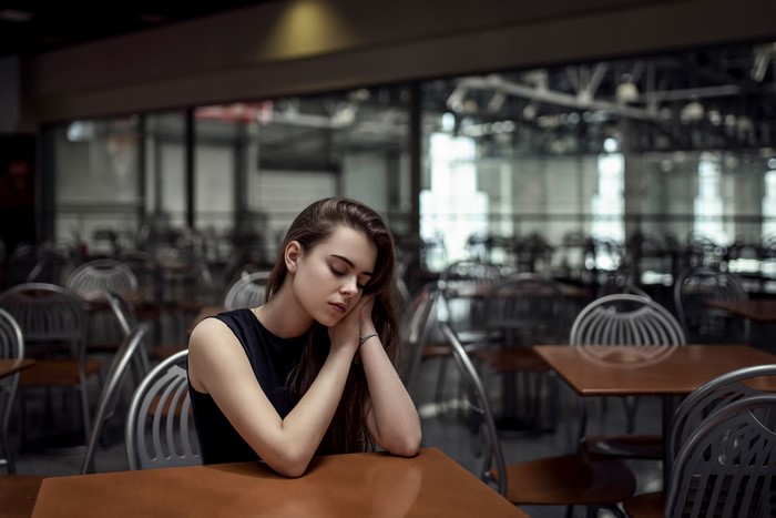 Ekaterina Kuznetsova sleeping at a cafe table