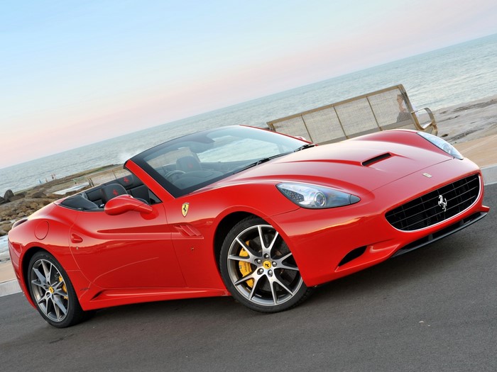 Red Ferrari California Convertible by the Ocean