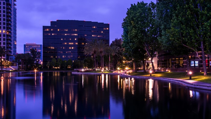 Cityscape with pond at night in California