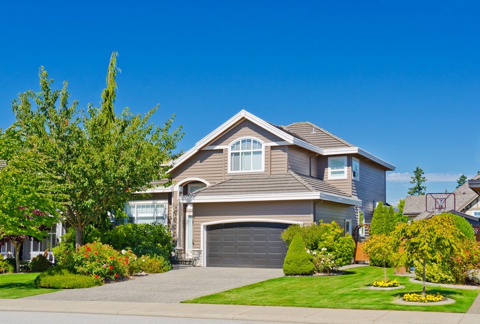 Suburban house with lawn and trees