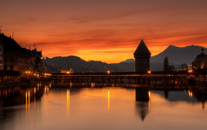 Chapel Bridge and Water Tower in Lucerne, Switzerland at Sunset