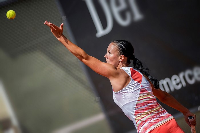 Eva-Maria Hoch serving a tennis ball