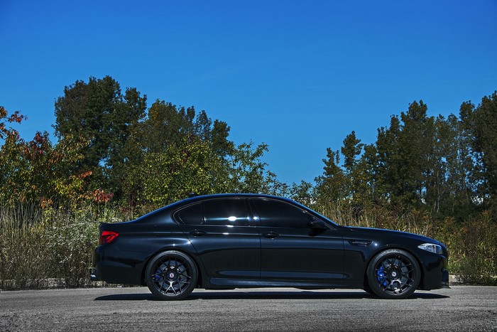 Black BMW M5 F10 Sedan on Road