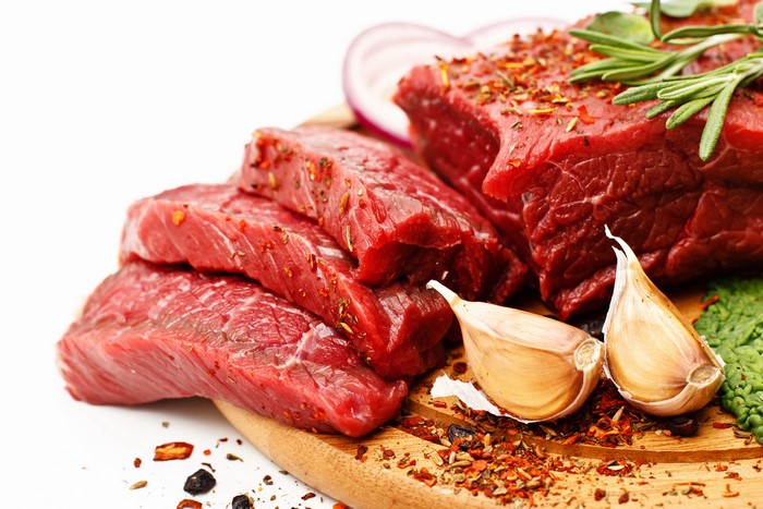Raw Meat Steaks with Garlic and Spices