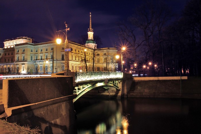 Bridge and building at night in St. Petersburg, Russia
