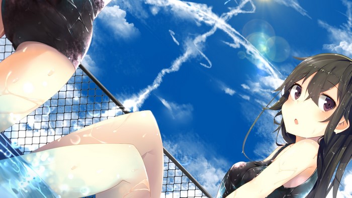 Girl in swimsuit looking up at the sky