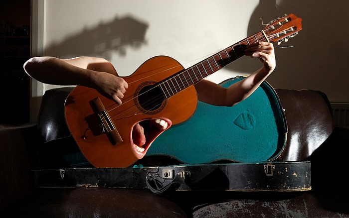 Guitar with a mouth and hands
