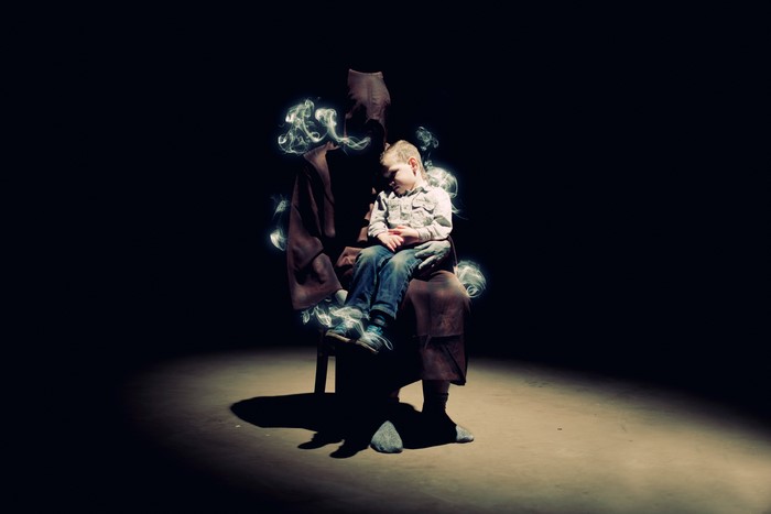 Boy sleeping on a figure with smoke