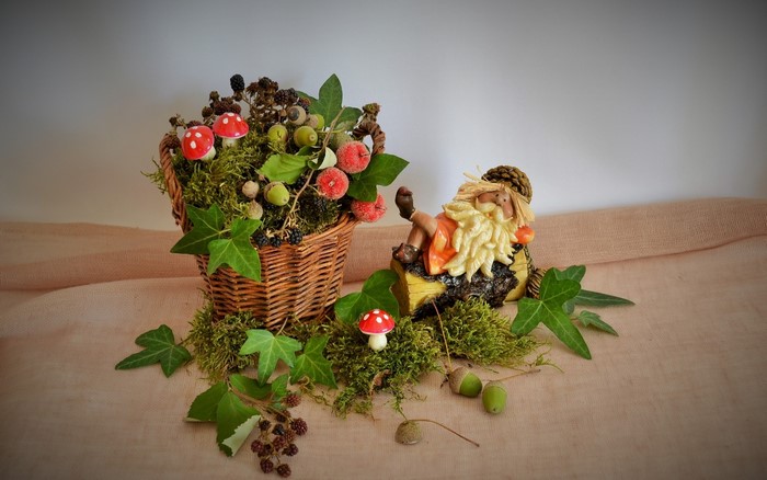 Autumnal arrangement with gnome and basket