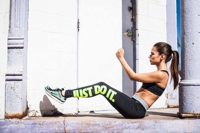 Woman in Nike leggings doing exercise