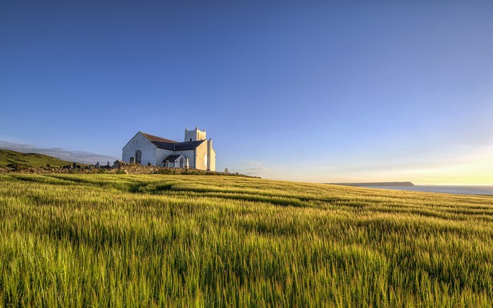 Ballintoy Parish Church on a grassy hill overlooking the sea