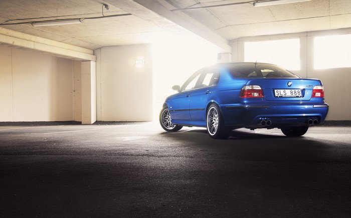Blue BMW E39 M5 parked in a garage