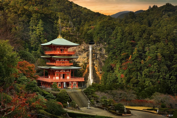 Pagoda temple with waterfall in a Japanese forest