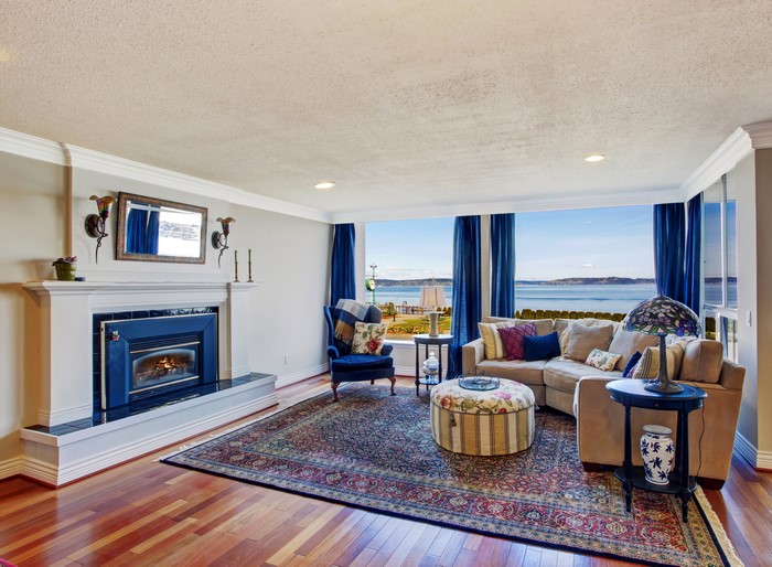 Living room with fireplace and ocean view