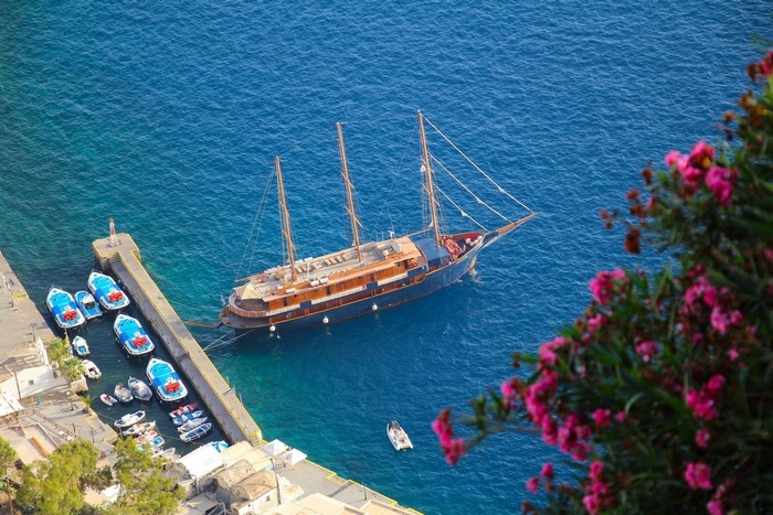 Sailing ship and boats in a Greek marina