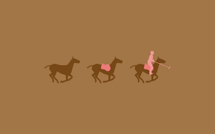 Polo players on horses