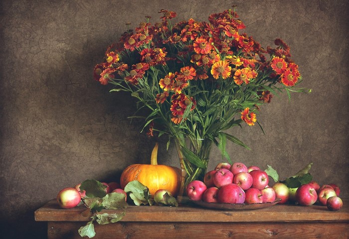 Still life with pumpkin, apples, and flowers