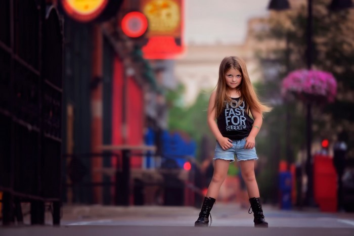 Confident Little Girl Standing on City Street