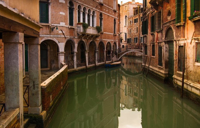 Venice canal with historic buildings and a bridge