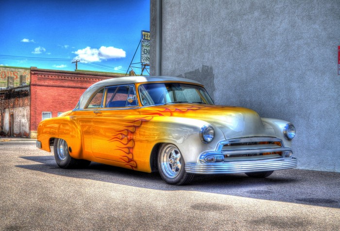 Yellow and white classic car with flames
