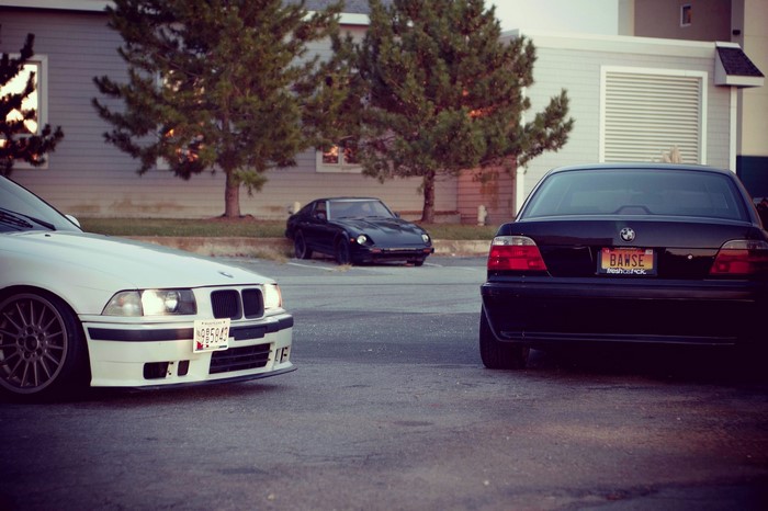 BMW E36 and E38 cars parked