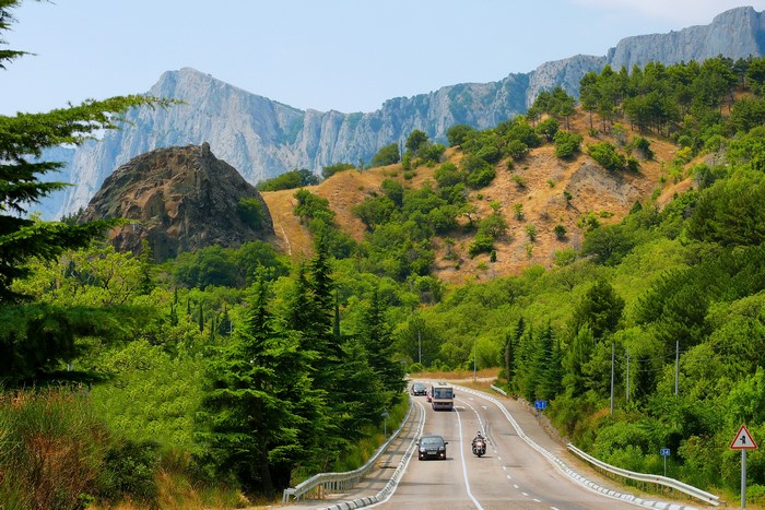 Road through mountains and forests in Crimea, Russia