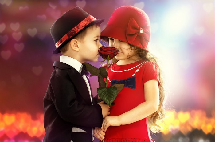 Two children sharing a rose