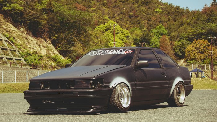 Black Toyota Corolla with "MURAI THE CAR ENTERTAINMENT" banner