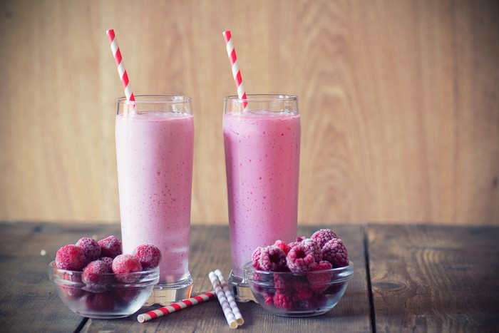 Raspberry Smoothies in Highball Glasses with Fresh Raspberries