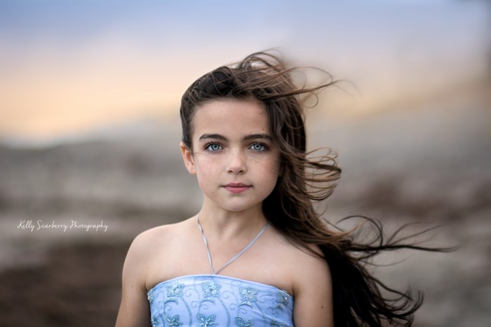 Young girl with blue eyes and brown hair