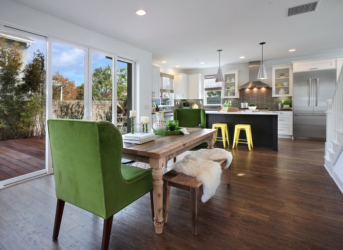 Modern Kitchen and Dining Area with Green Chairs