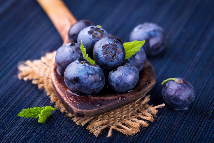 Blueberries on a wooden spoon