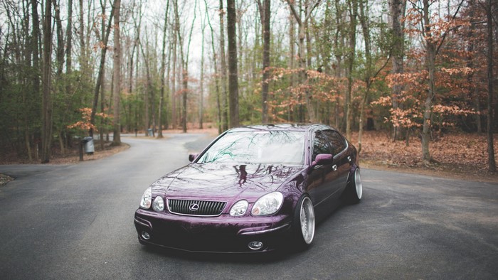 Purple Lexus GS430 parked on a road in a forest