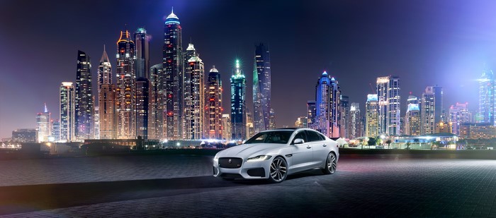 White Jaguar 2015 XF S AWD in Dubai at Night